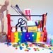 rainbow striped upcycled toolbox-- store art supplies, skittles, whatever your heart desires...