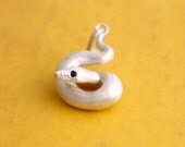 The Blue Eyed Beauty, a blue eye leucistic ball python in sterling silver.