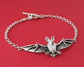 The Bat Bracelet, a custom handmade sterling silver piece.