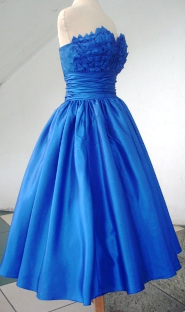 Alluring intricate, 50s inspired ball dress with beautiful bust detail inspired by blooming petals