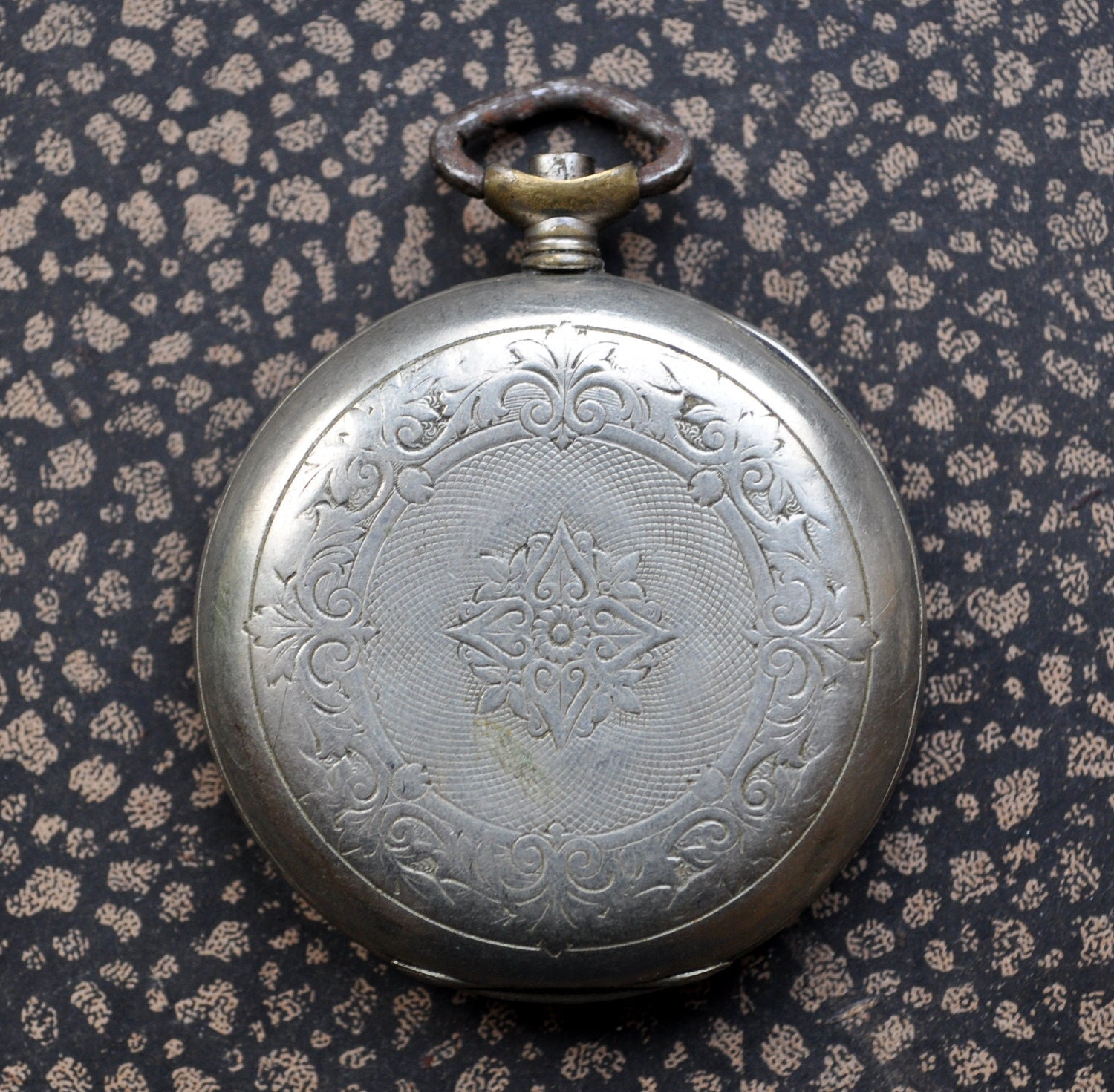 Antique pocket watch case.