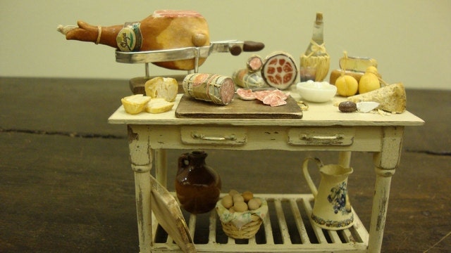 Miniature table  shabby chic set up with salami and typical Italian products