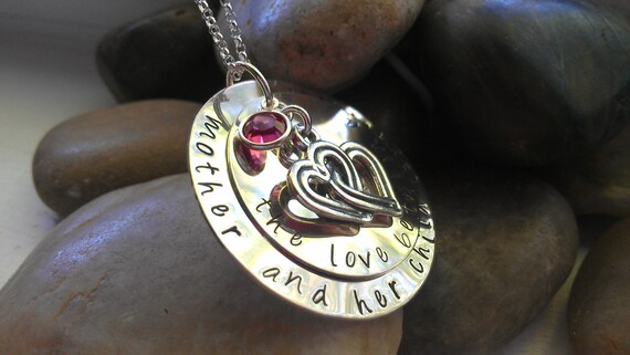 the love between a mother and her child is forever sterling handstamped necklace