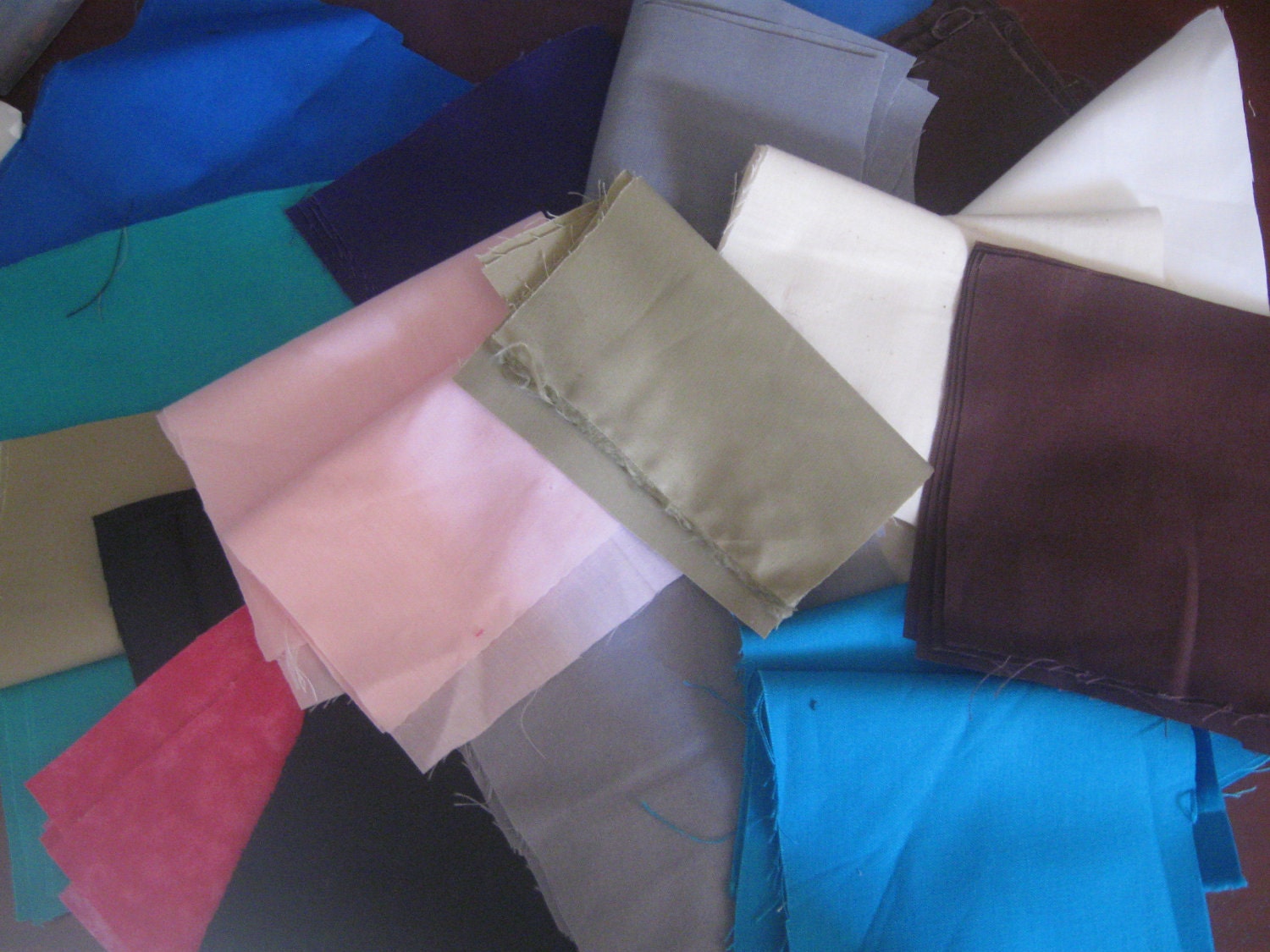 80 Fabric scraps pieces for quilting sewing solids mostly  for doll clothes crafts and many projects
