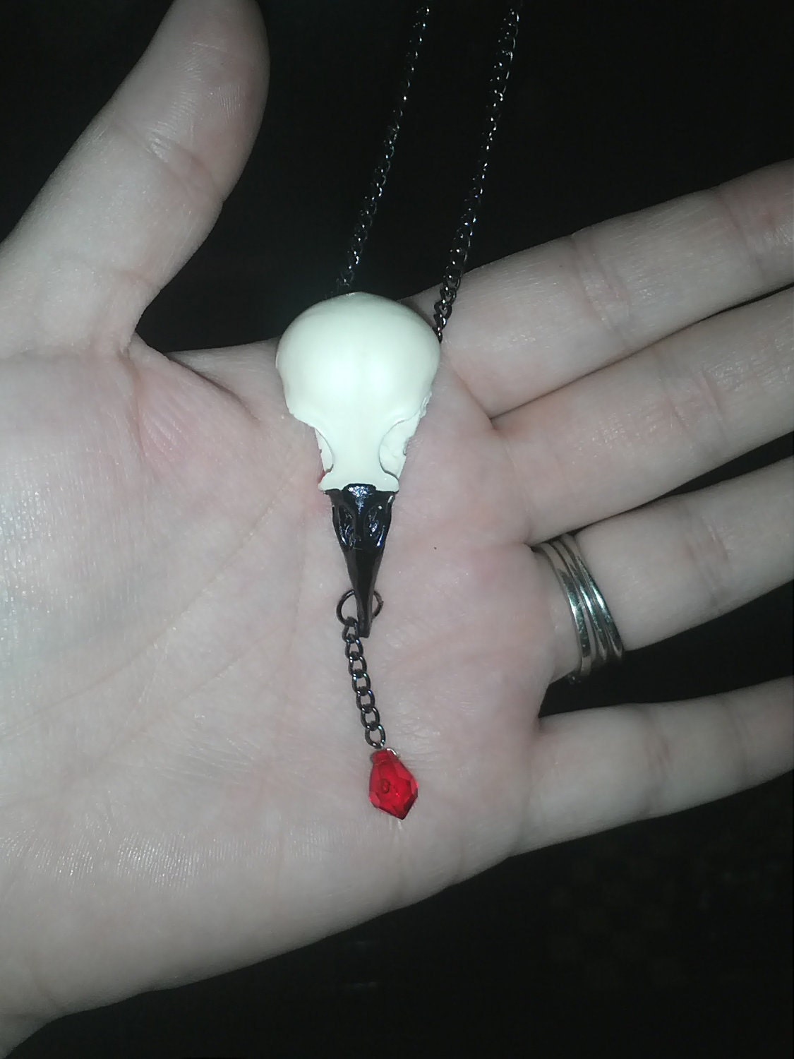 Replica starling skull necklace with blood drop