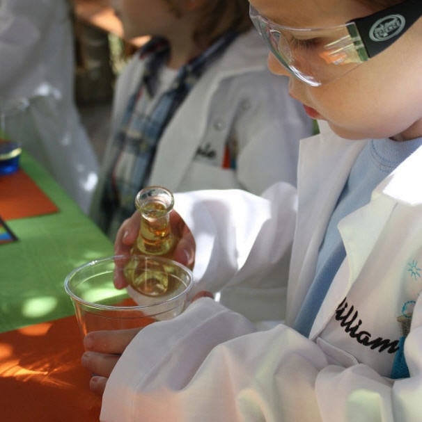 Lab coat embroidered with colorful test tubes and name in black by SewJewell