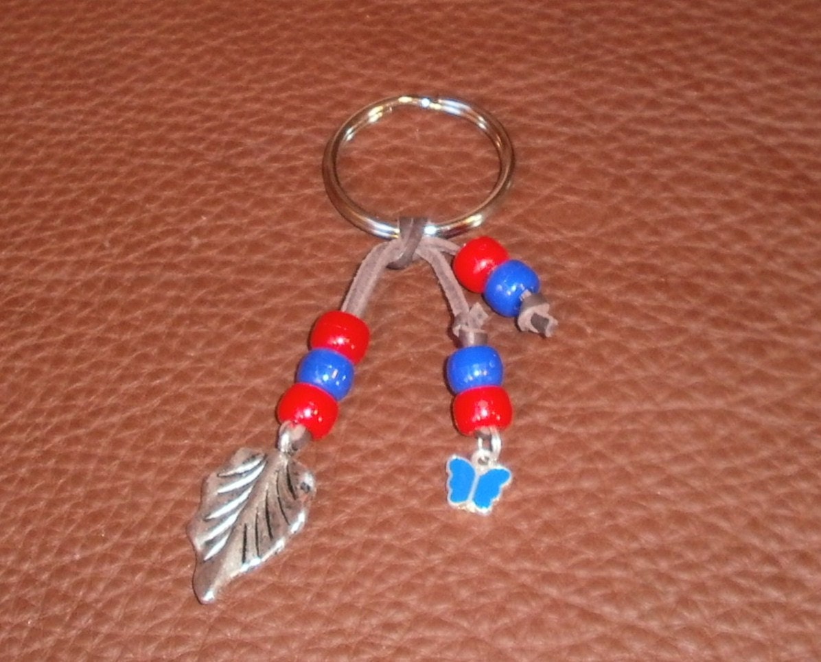 Fringe Inspired Metal Leaf and Blue Butterfly Leather Keychain
