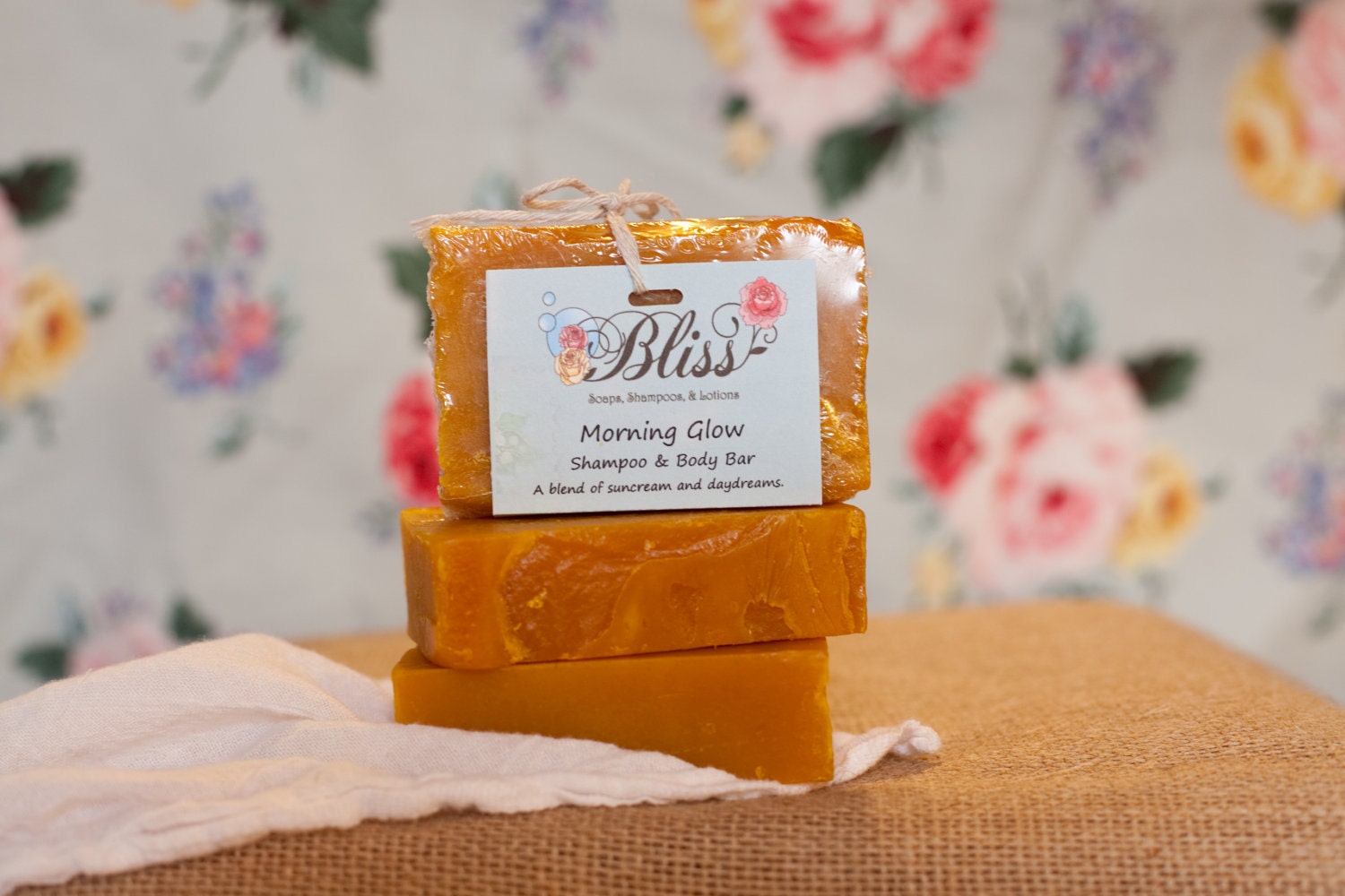 Morning Glow -  Handcrafted shampoo and body bar scented with cinnamon, orange, and cloves.  A blend of suncreams and daydreams.