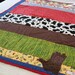 ChristmasInJuly Boy's Cowboy Quilt, crib/toddler size, Rodeo scrappy strip blanket with appliqued cowboy boot, OOAK