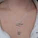The Hunger Games - Sterling Silver Katniss Mockingjay Pin Archery Necklace with Peeta's Pearl - Lariat
