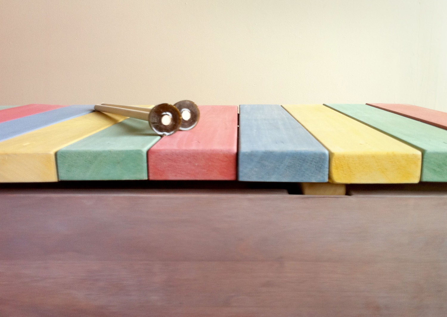 Wooden xylophone lid on cedar chest. Easy to play, built to last.