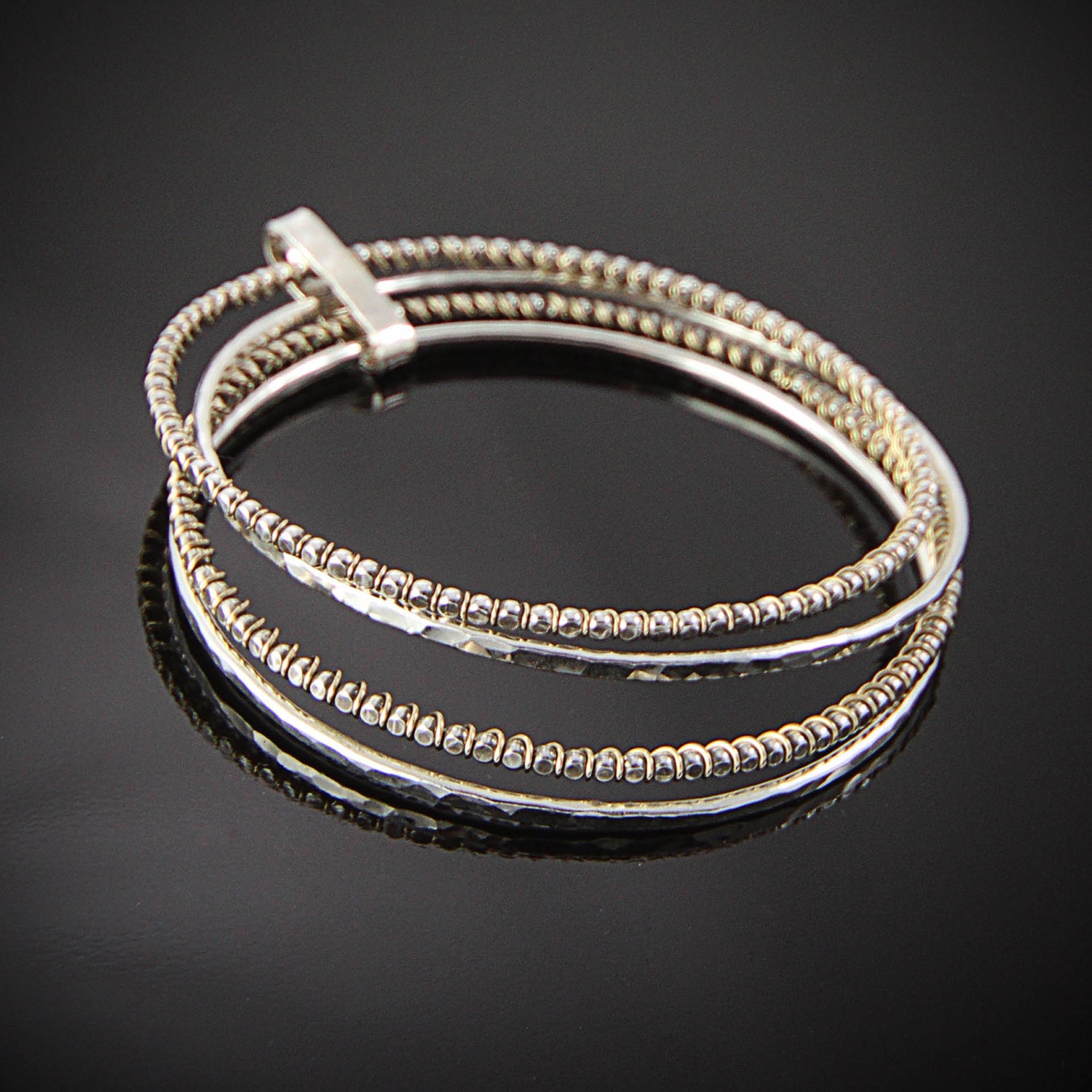 Sterling and gold filled bangle bracelets, set of four, oxidized, black, hand foged and fabricated, metalwork