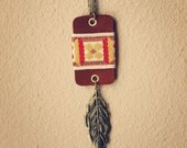camille.  a long boho suede and feather necklace.