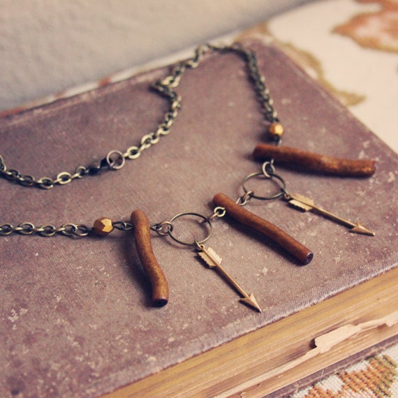 jocelyn.  a golden coral and arrow choker.
