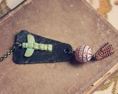 kundi.  a beaded leather and tassel animal totem necklace.