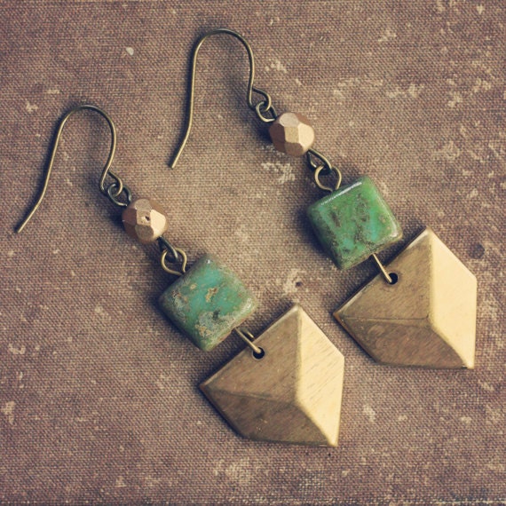 ocean. a pair of gold and green geometric chevron earrings.