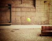 Balloon and couch under the Manhattan Bridge in DUMBO, Brooklyn NY