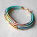 Pastel colors Leather Bracelet with 12 Golden tubes by pardes israel
