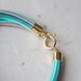 Pastel colors Leather Bracelet with 12 Golden tubes by pardes israel