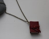 I Carry Your Heart With Me by e.e. Cummings. Necklace with poem.
