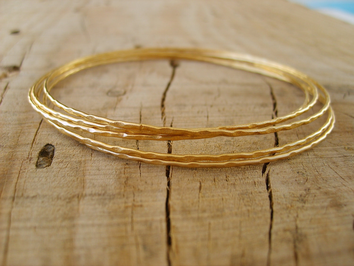 Hand crafted thin bangle bracelets in gold, gold bangle bracelets