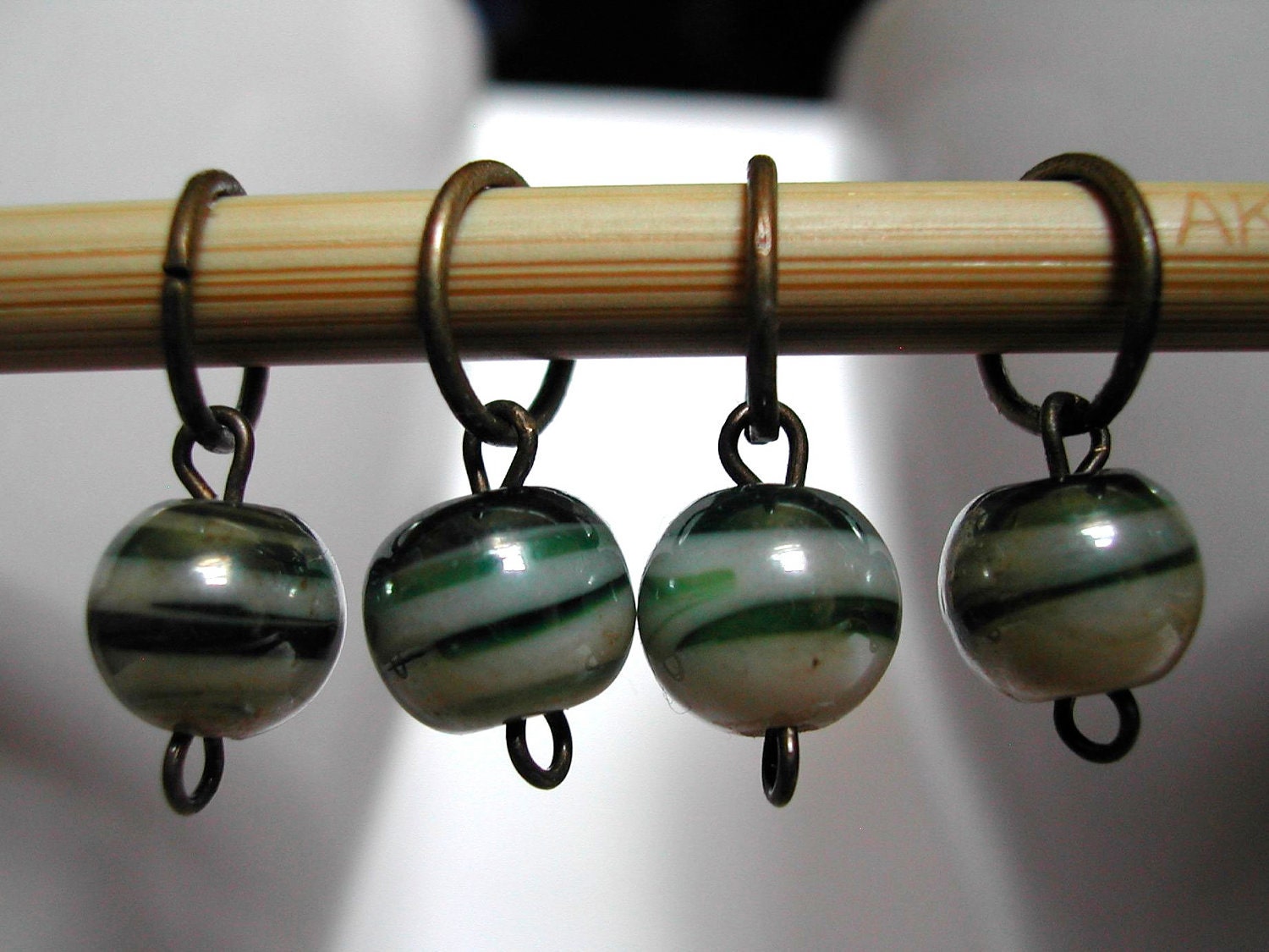 SALE 25% off: Stitch Markers (4) -- medium, green and cream swirl beads, antique bronze