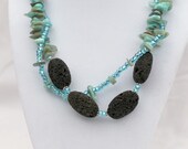 Blue and brown necklace with mother of pearl and lava, double-stranded with Tibetan silver and seed beads