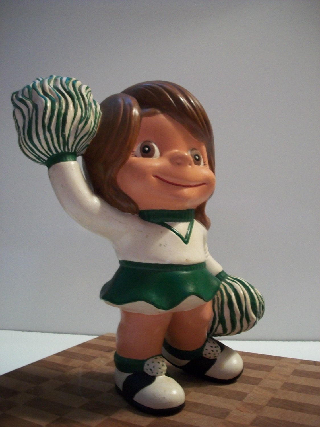 Vintage 1970s Atlantic Mold Ceramic Cheerleader Figurine Green and White - MarciesNook