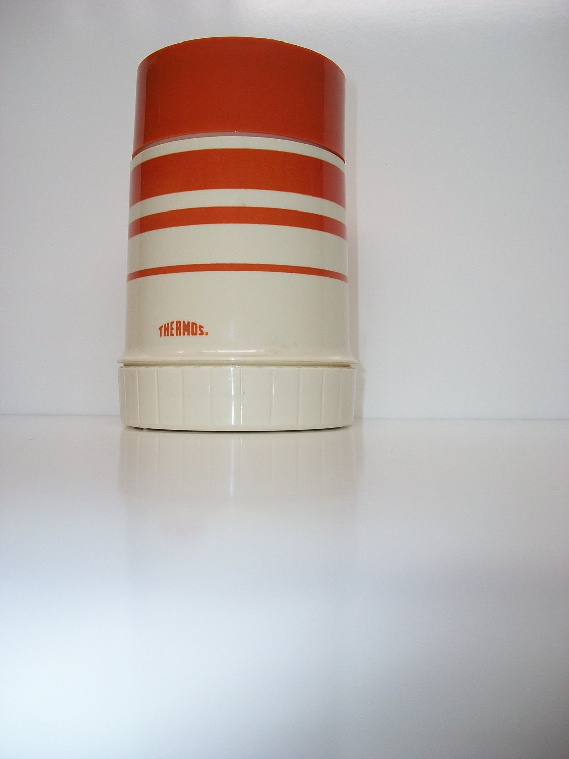 Vintage burnt orange retro Thermos for hot or cold beverages