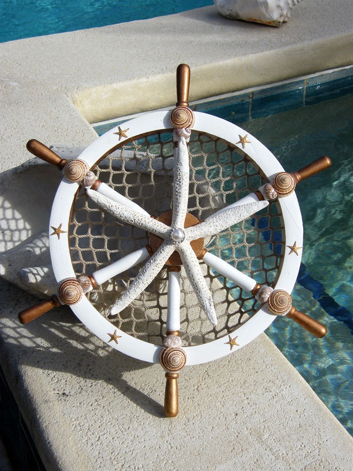 Gold Leaf, Wooden Ships Wheel with Starfish, Seashells, Nettings, Pearl and Crystals. For Holidays or Year Round Home Decor.