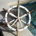 Gold Leaf, Wooden Ships Wheel with Starfish, Seashells, Nettings, Pearl and Crystals. For Holidays or Year Round Home Decor.