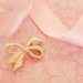 Vintage Gold Tone Ribbon Brooch with Rhinestones