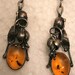 A sterling silver vintage set of earrings with true amber around 1970
