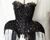 Black pvc embroidered steel boned armour corset with feather trim