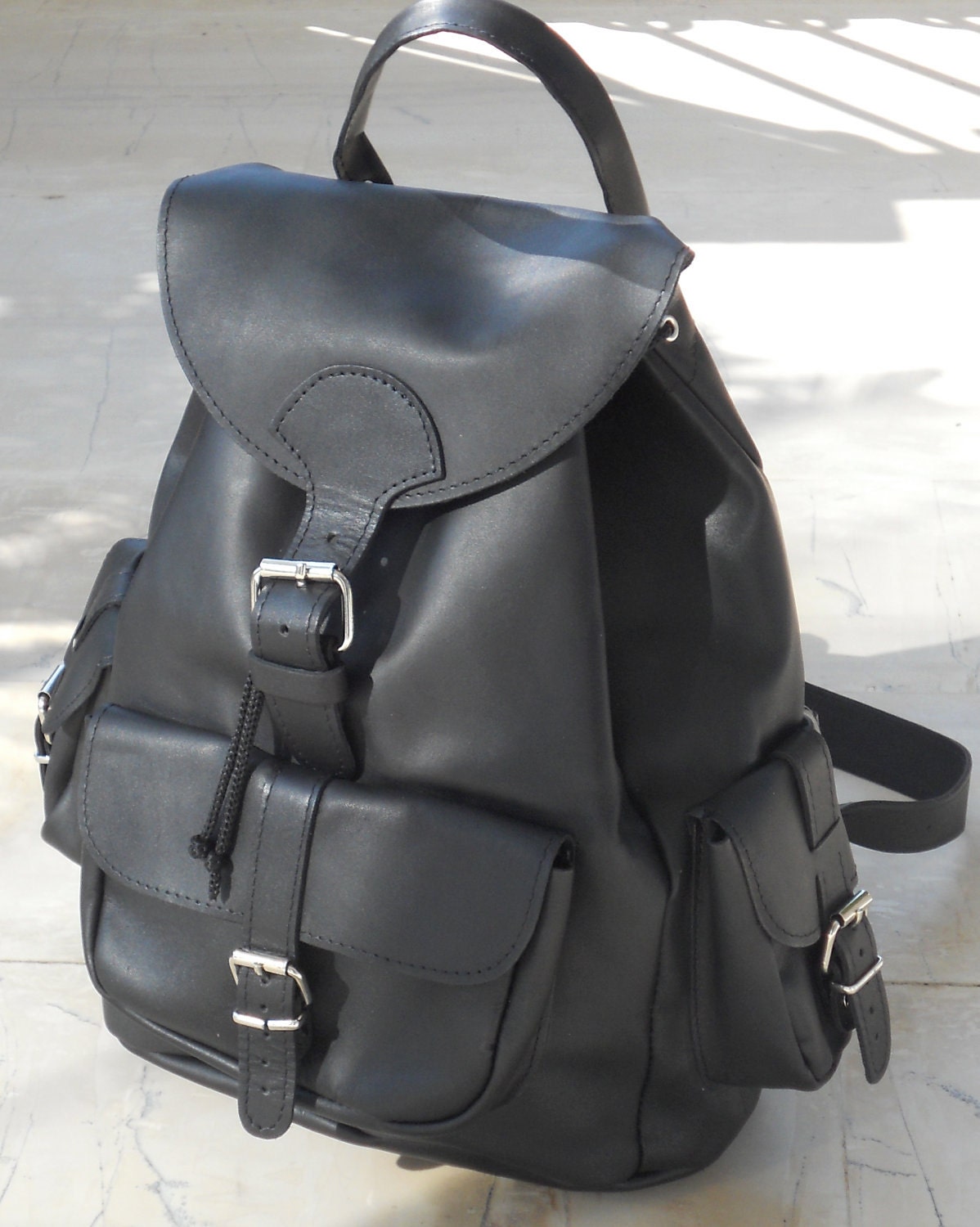 Leather backpack three pockets black