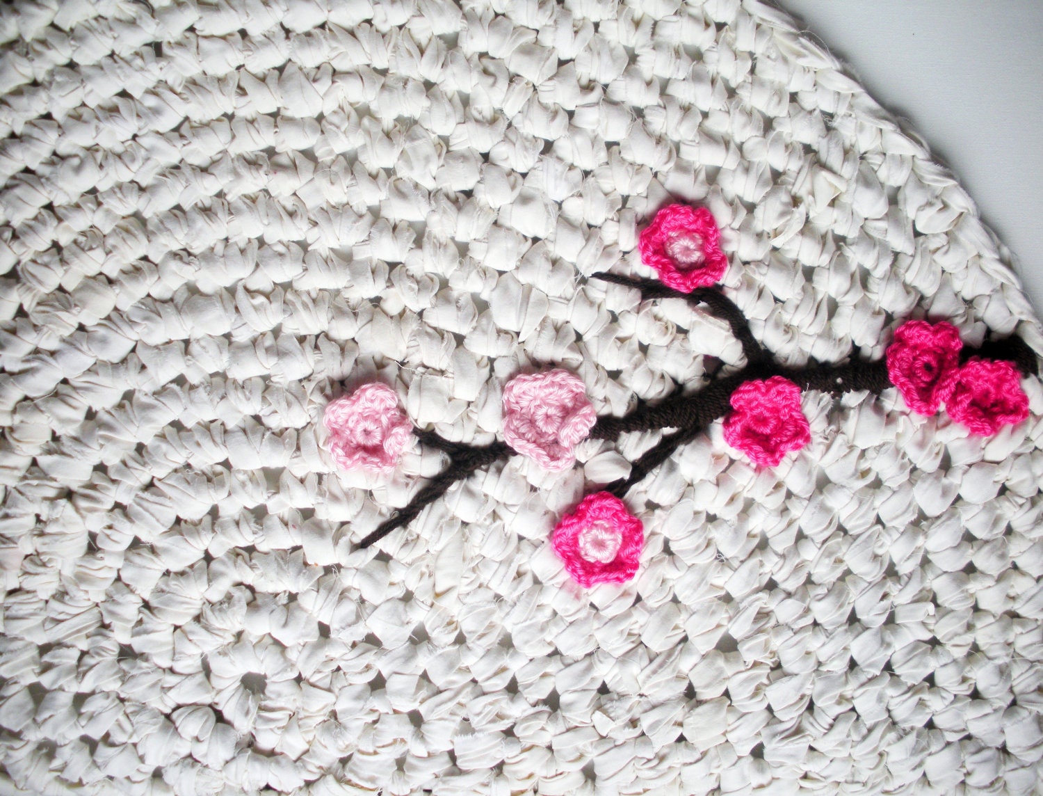 Crochet Rug Cherry Tree White Cotton with Pink Flower Appliques and Alpaca Wool Branch as featured in Inside Crochet Magazine