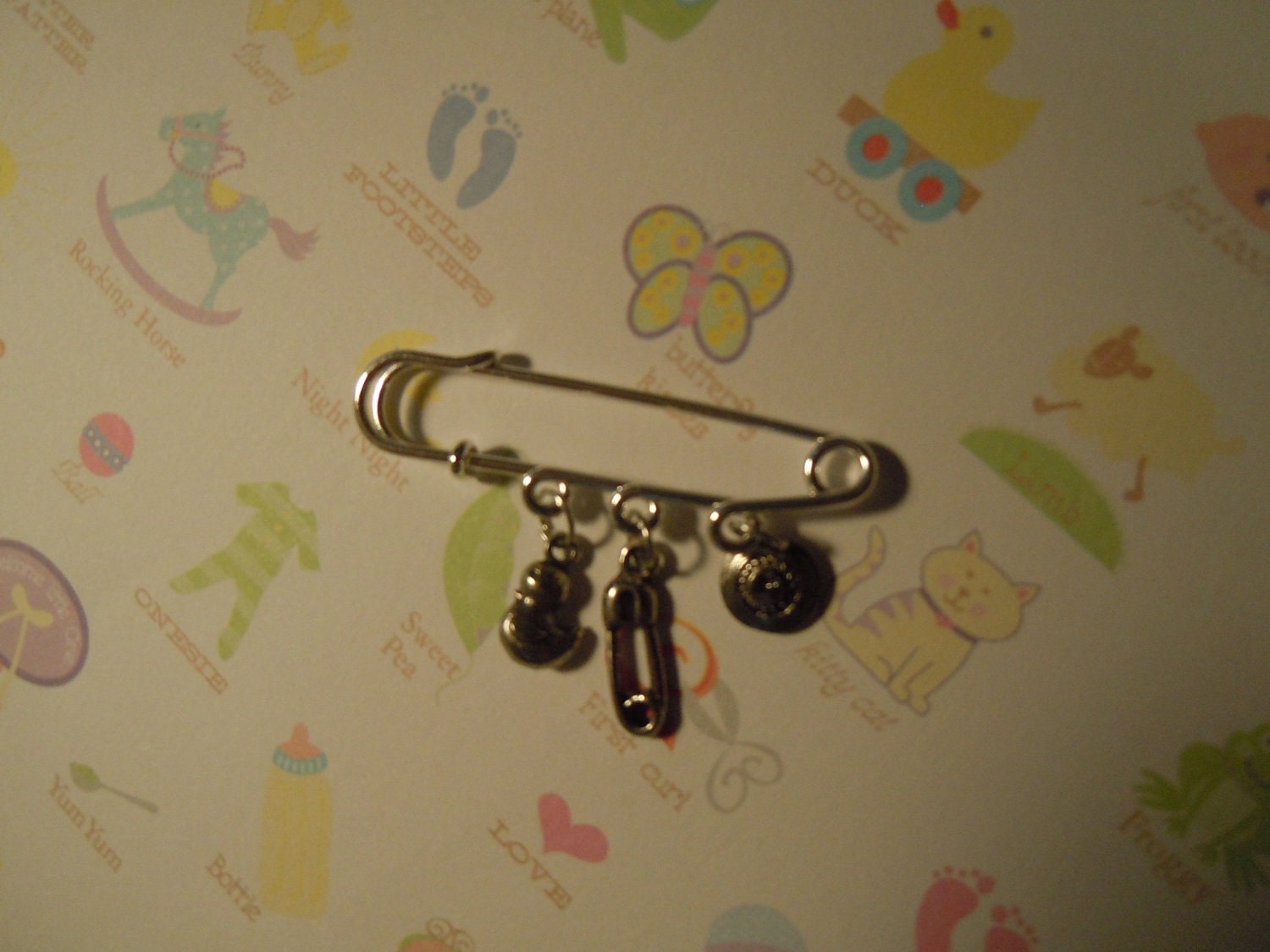Baby on the Way brooch with little baby item dangles