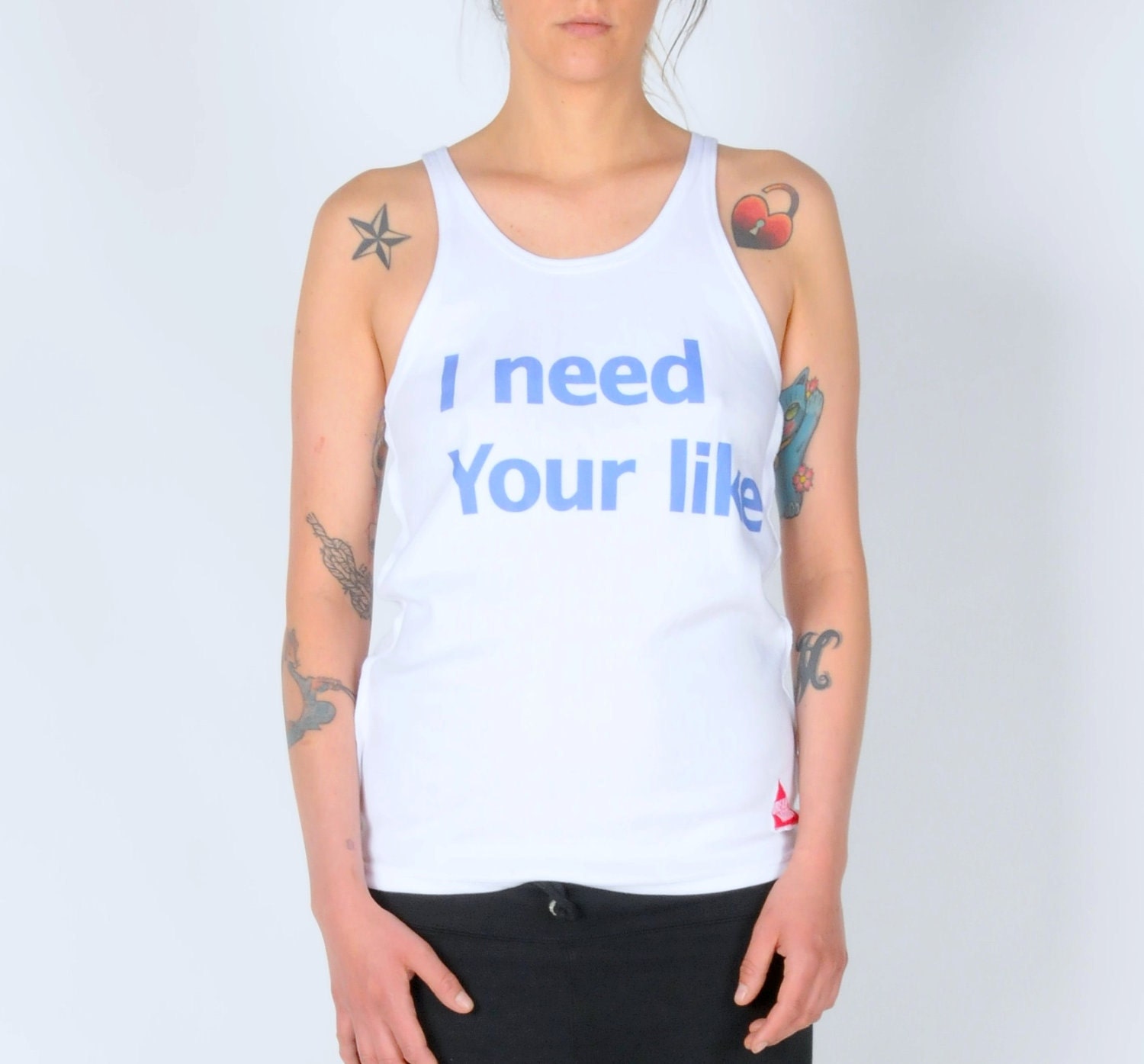 organic cotton vest with i need your like on it .women size s/m - DreamNation
