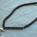 Retro Black Glass Donut Bead Necklace w Silver Finish Rhinestone Skull & Cross Bone Pendant
