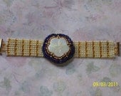 Cream and Gold Band with a 2 inch Diameter Bead Embroidery Focal