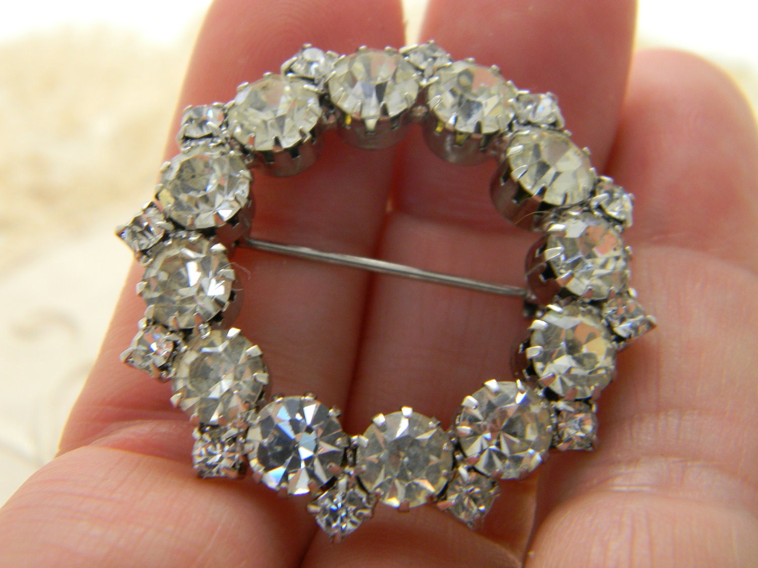 Vintage rhinestone circle brooch prong set silver tone
