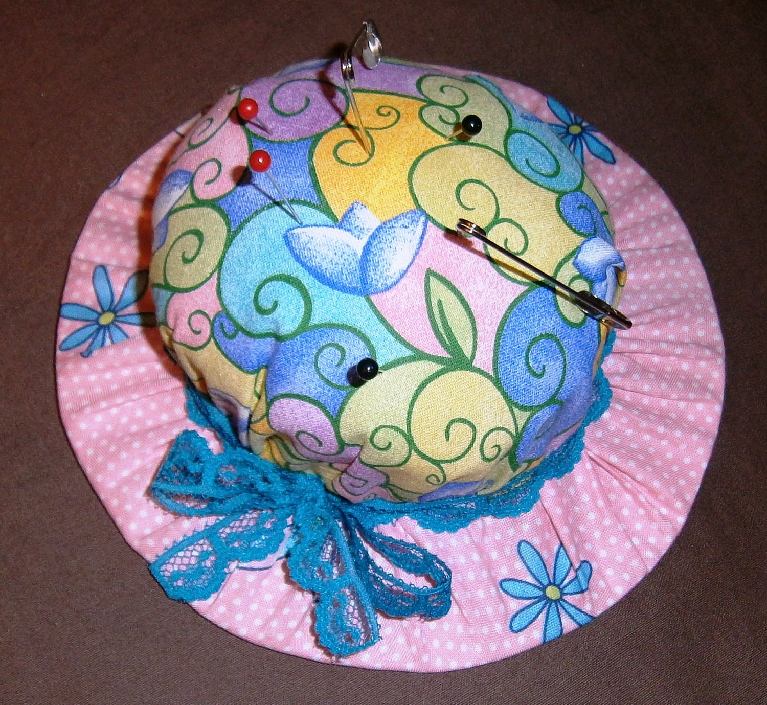 Hat Shaped Pin Cushion floral with blue lace ribbon tied in a bow