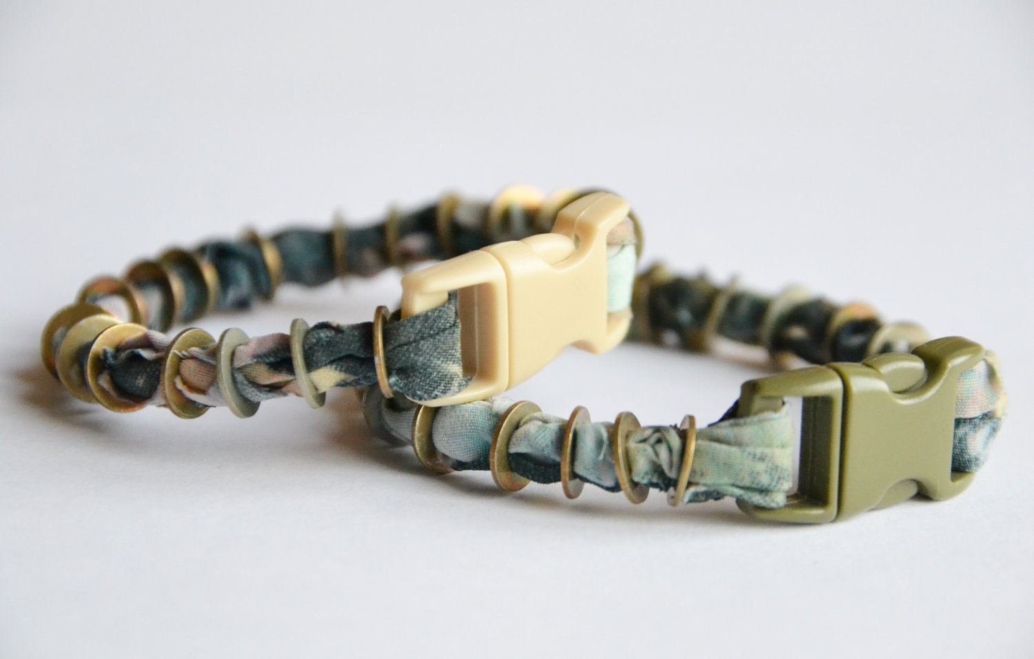 SALE. Fabric and metal cuff. Pastel fabric with vintage nuts and bolts and snap buckle closure. Small size. 25% OFF.
