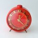 Vintage red alarm clock made in Russia