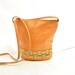 90s ORANGE STUDDED BAG / genuine leather / gold and silver geometric metal / bucket shape .