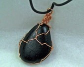Beach stone necklace with copper wire wrapped black beach stone