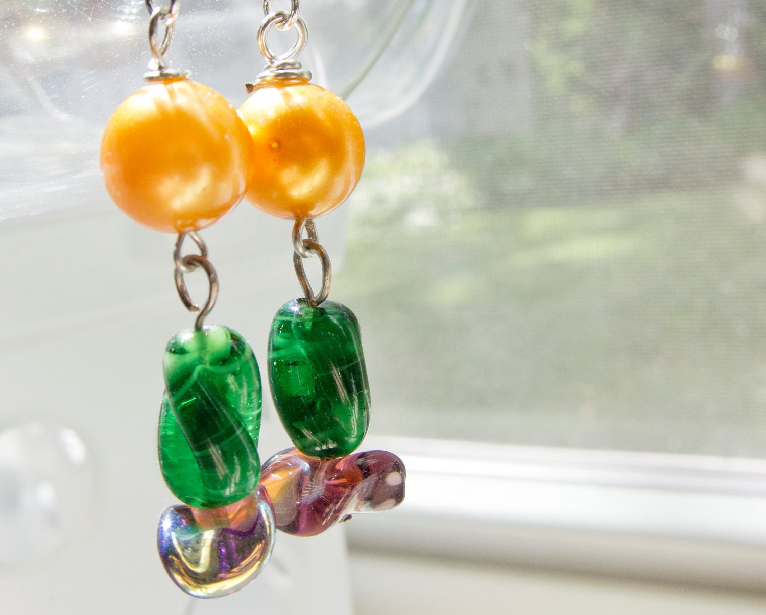 Golden yellow, green and purple glass bead dangle earrings
