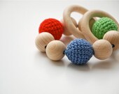 Teething toy with crochet wooden beads and 2 wooden rings. Red, green, blue wooden beads rattle.