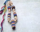 Colorful nursing necklace with wooden stick. Mammy and baby multicolor teething necklace. Girls crochet necklace.