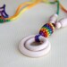 Teething rings nursing necklace with wooden beads and crochet over wooden olive, multicolor teething toy.